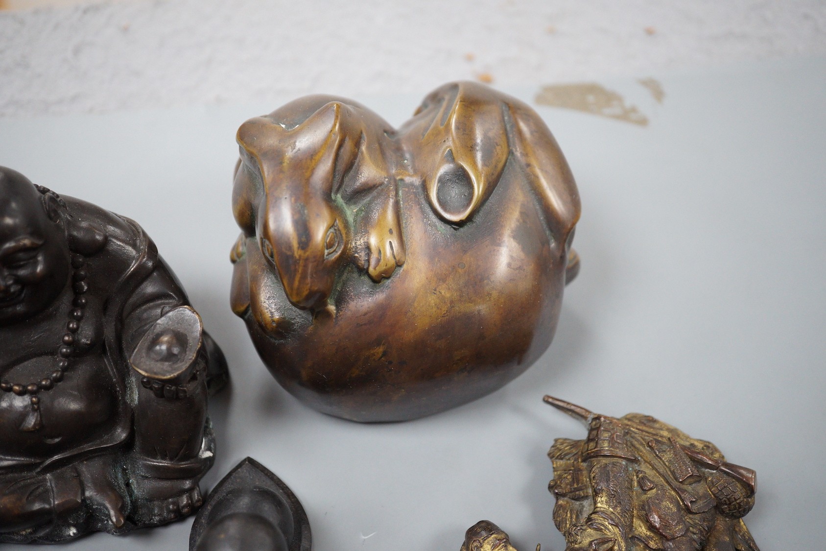 A bronze group of two rabbits, 11.5cm wide, a Chinese Buddha group and assorted metalware